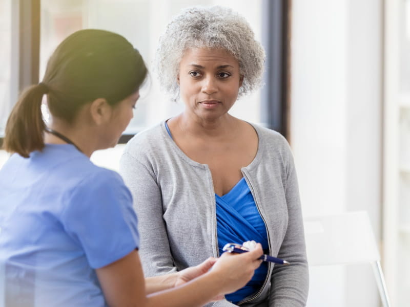 female doctor talking to female patient