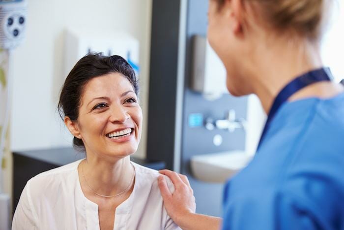 nurse talking to patient