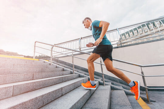 man running up stairs