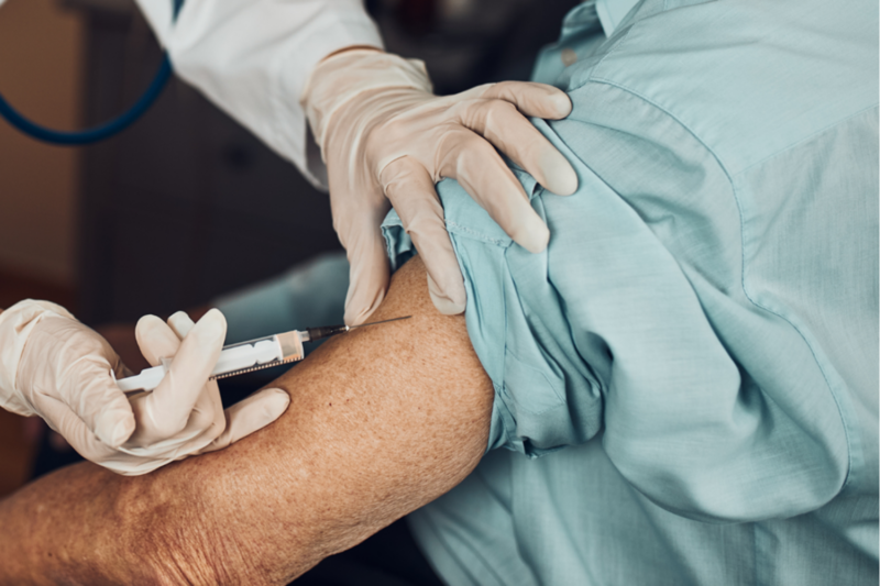 man receiving an injection