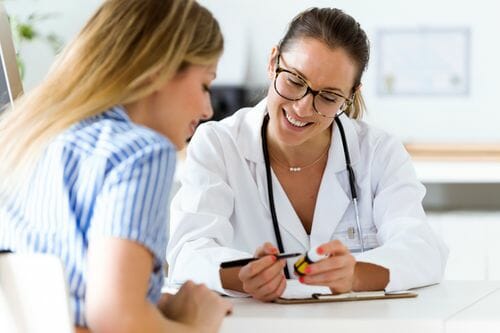 female doctor talking to female patient