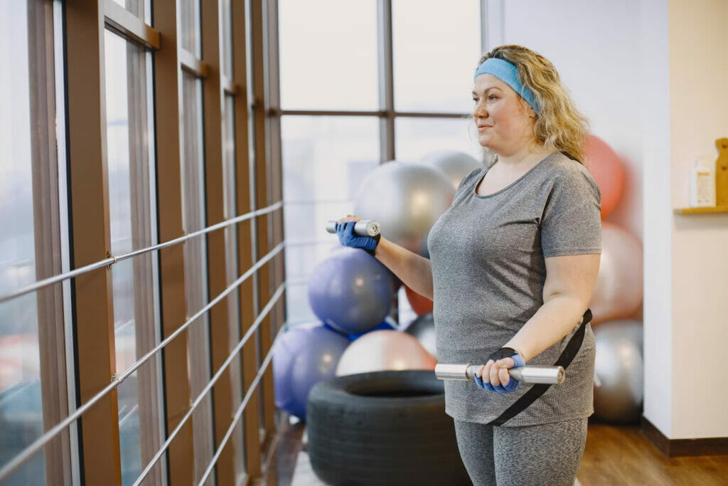 plus sized woman working out at gym