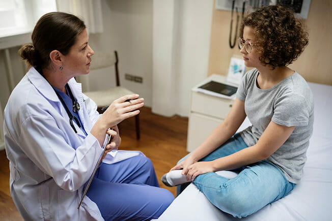 female doctor talking to female patient