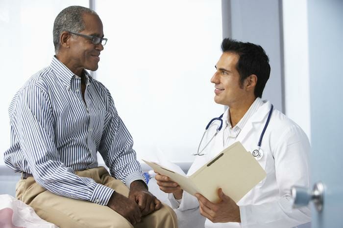 male doctor talking with male patient