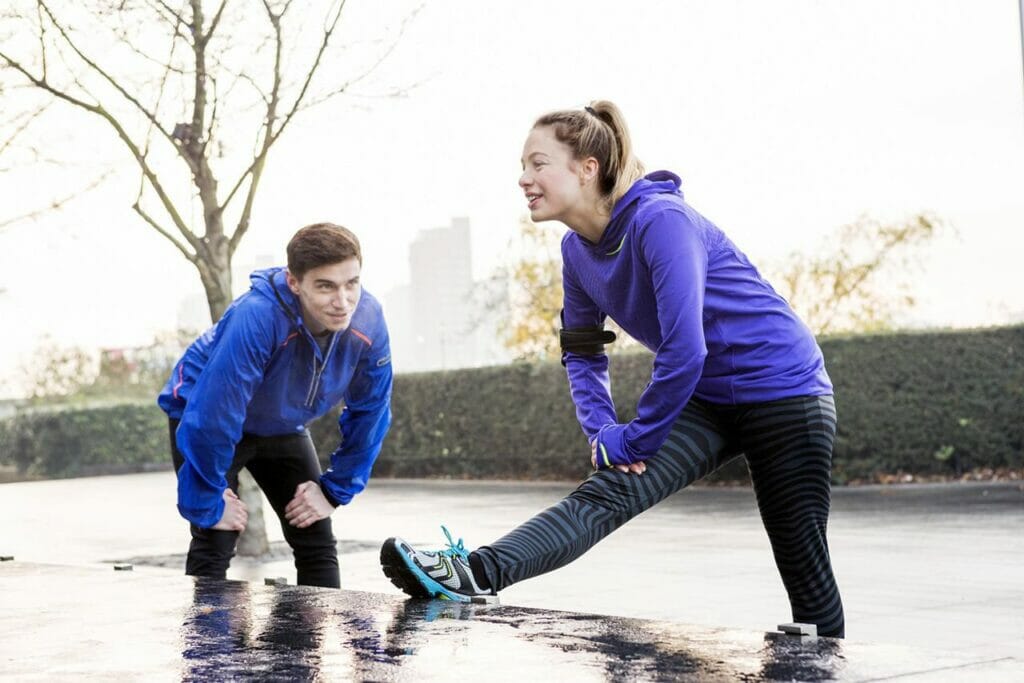 couple stretching outside