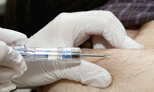 man receiving an injection