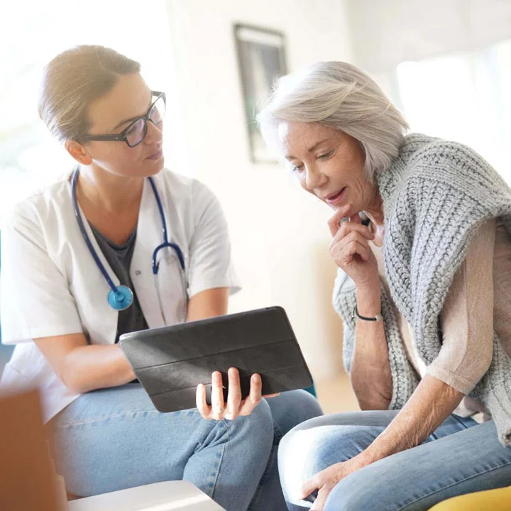 female doctor talking with female patient