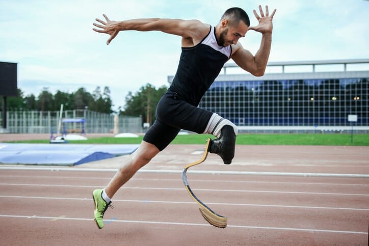 amputee man running on track