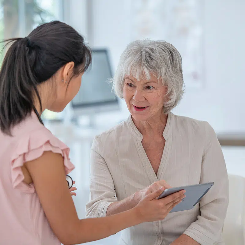 female doctor talking with female patient