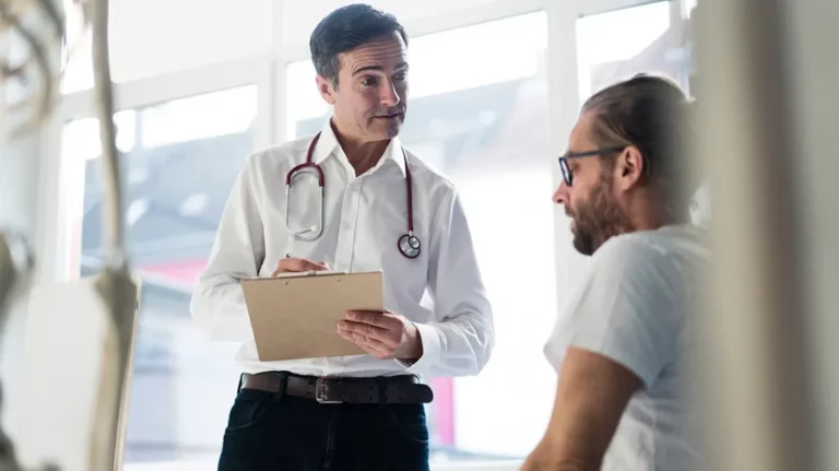 male doctor talking with male patient