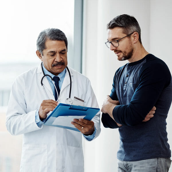 male doctor talking with male patient