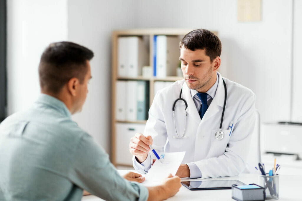 male doctor talking with male patient