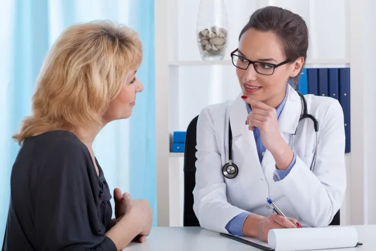 female doctor talking with female patient