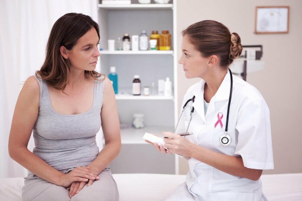 female doctor talking with female patient