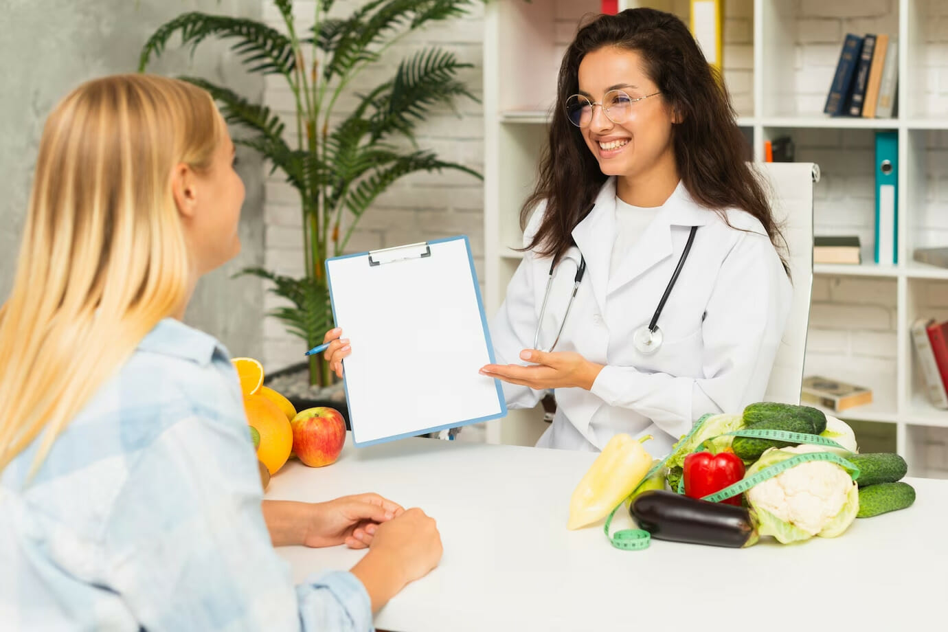 female doctor talking with female patient