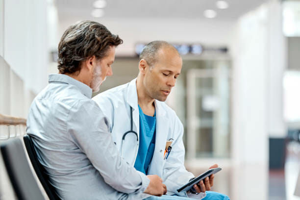 male doctor talking with male patient