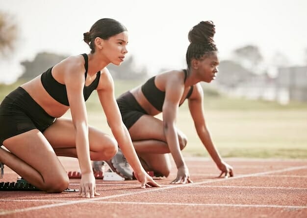 two women on a running track