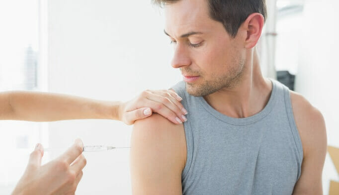 man receiving an injection