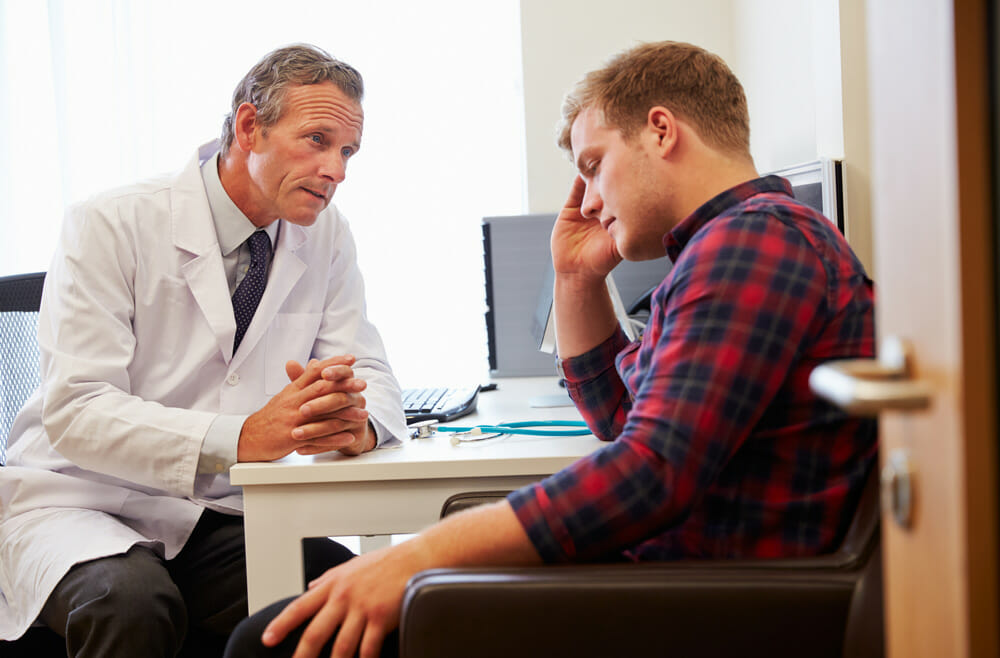 male doctor talking with male patient