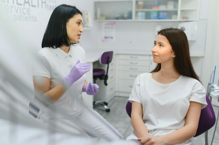 woman doctor talking with woman patient